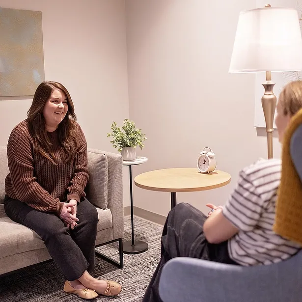 client smiling at therapist