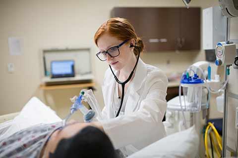 female nurse with simulated patient